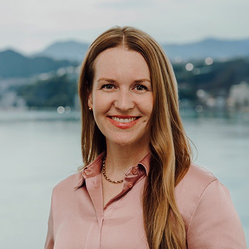 Dr Amanda J. Williamson, professional headshot with Wellington harbour in the background